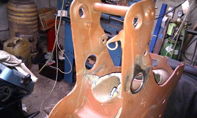 Frame cut for swinging arm pivot